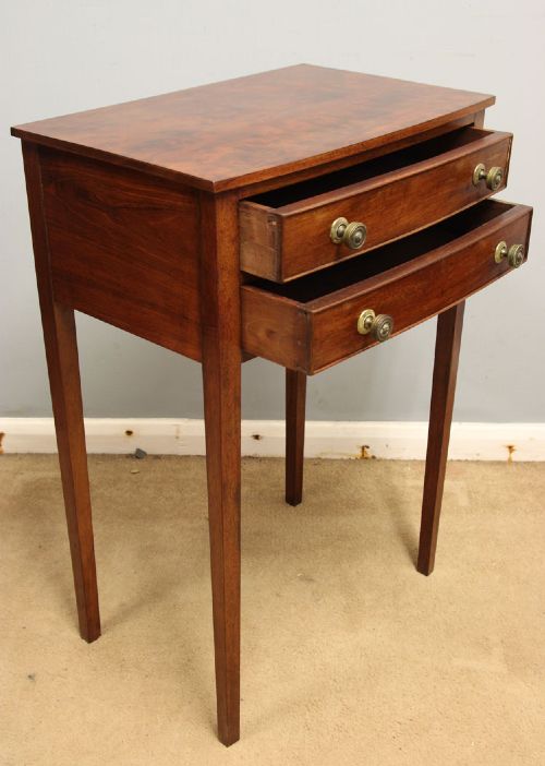 A pair of slim mahogany bedside tables, each featuring two drawers with brass knobs and tall square tapered legs. View VII