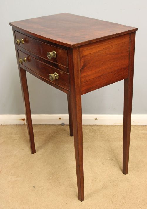 A pair of slim mahogany bedside tables, each featuring two drawers with brass knobs and tall square tapered legs. View VIII