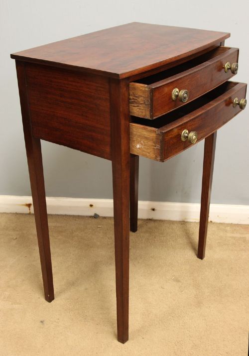 A pair of slim mahogany bedside tables, each featuring two drawers with brass knobs and tall square tapered legs. View IX