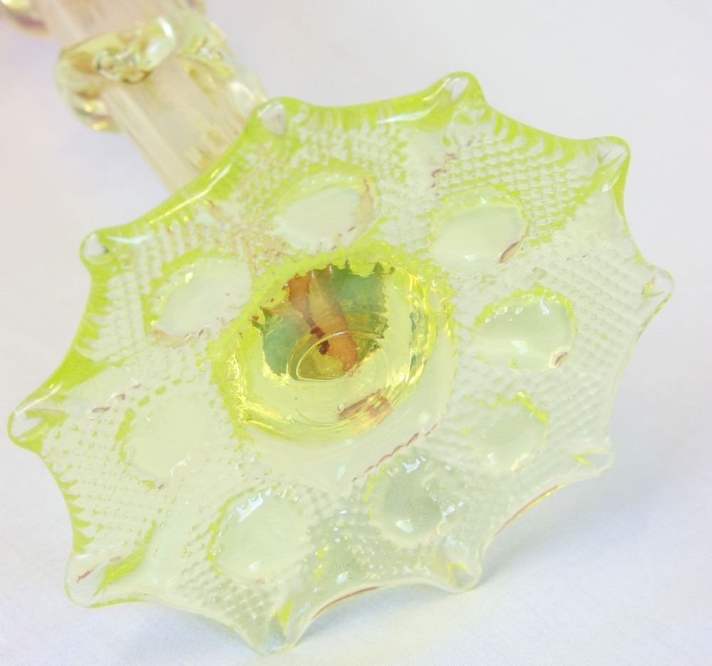 A tall Victorian art glass trumpet vase featuring a ruffled pink cranberry glass rim, applied green glass spiral trailing on the stem, and a moulded uranium green glass base. View XII