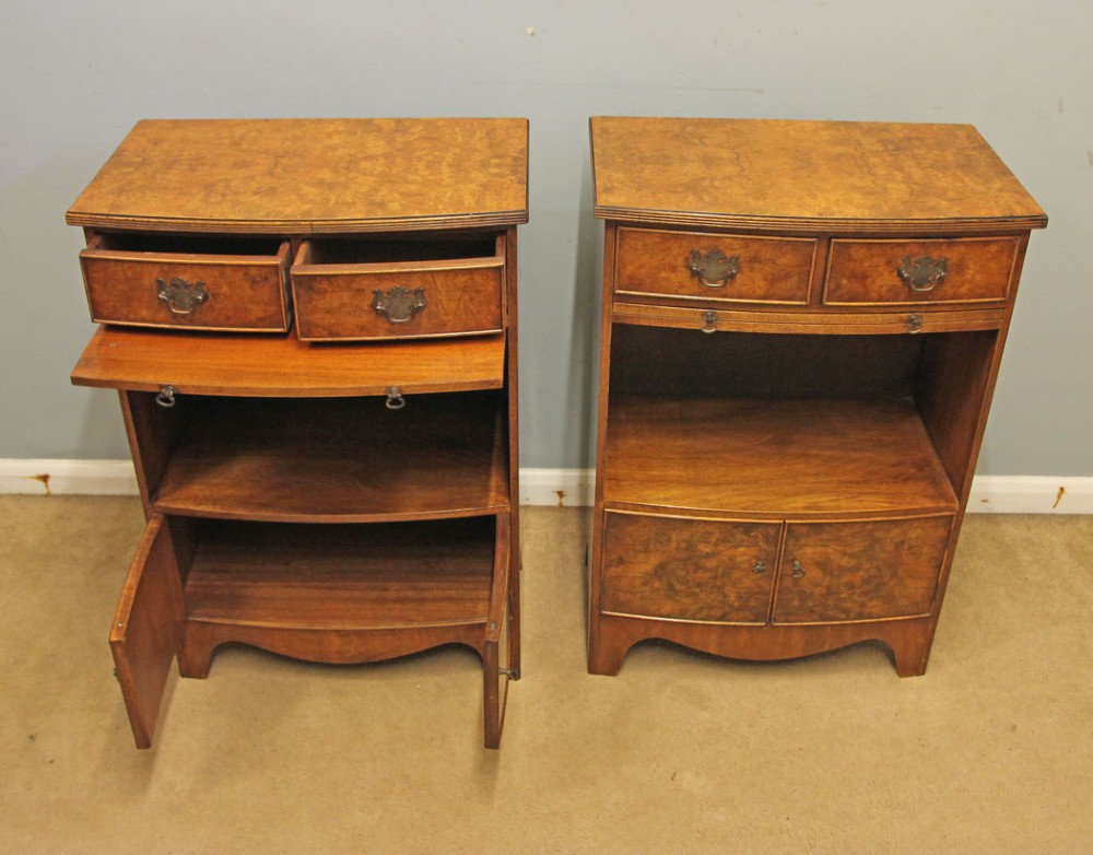 A pair of antique burr walnut bedside cabinets featuring top drawers, pull-out slides, open middle shelves, and double-door lower cupboards. View IV