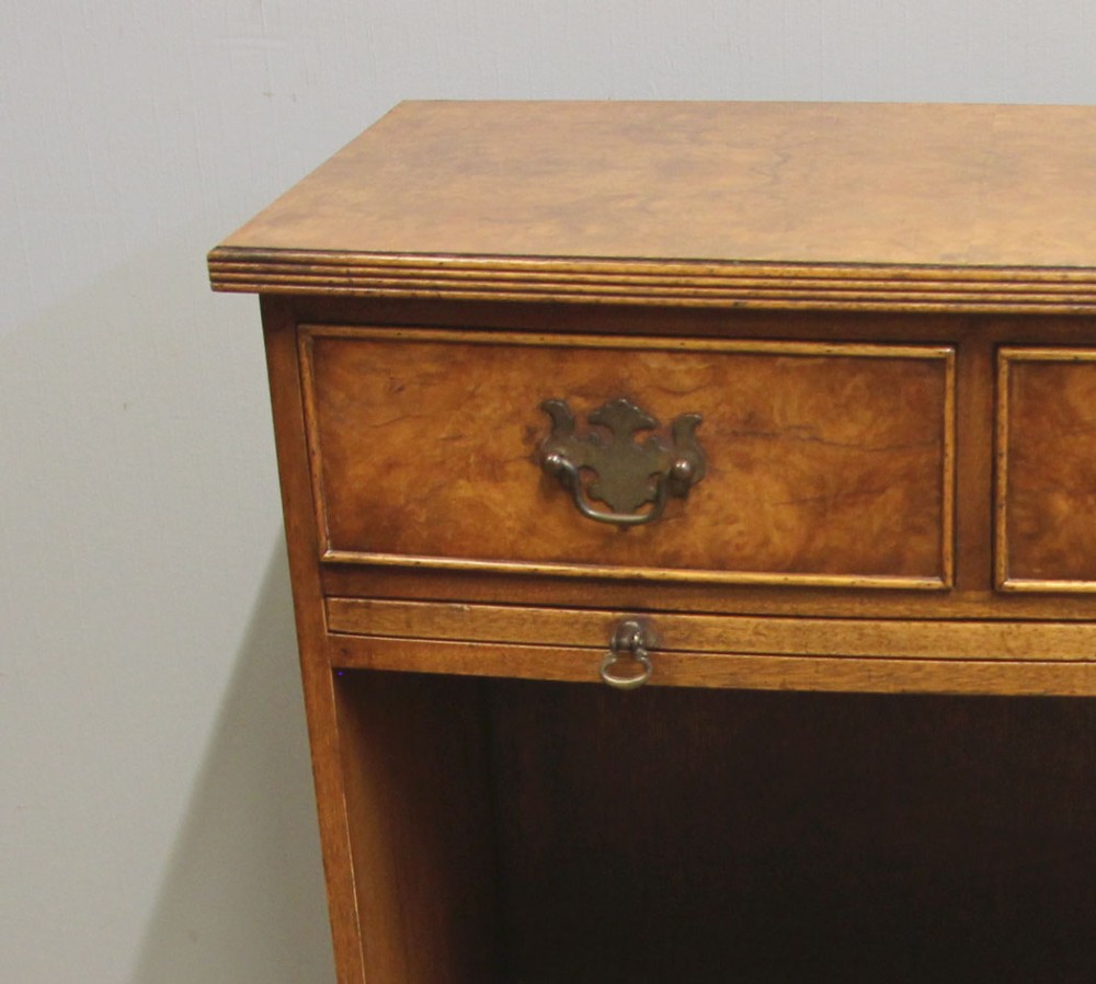 A pair of antique burr walnut bedside cabinets featuring top drawers, pull-out slides, open middle shelves, and double-door lower cupboards. View XIV