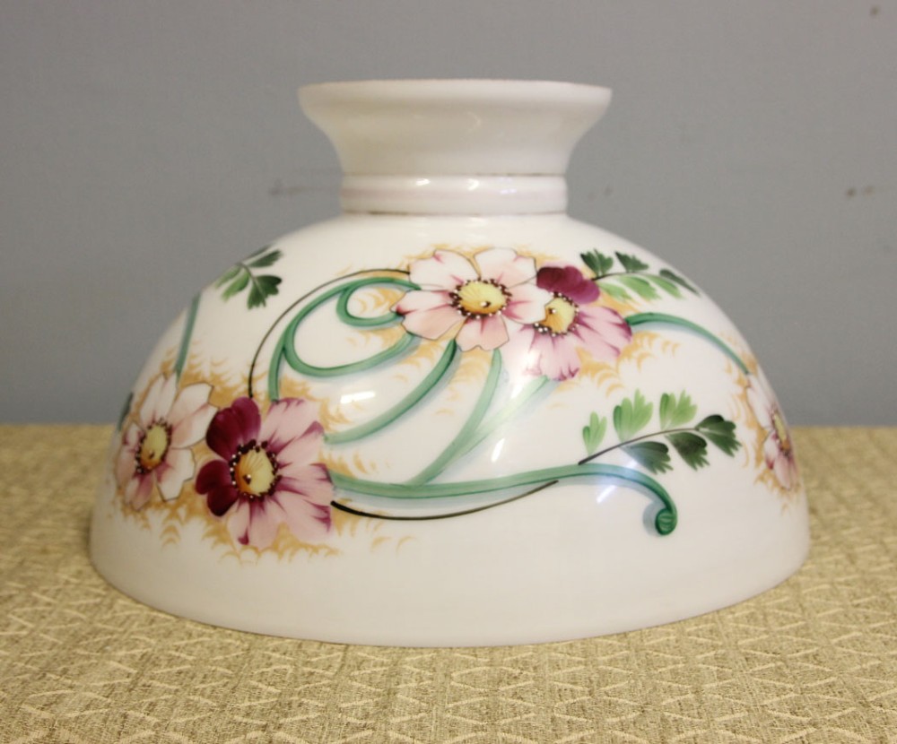 A domed white opaline glass oil lamp shade decorated with hand-painted pink floral motifs and green foliage. View II