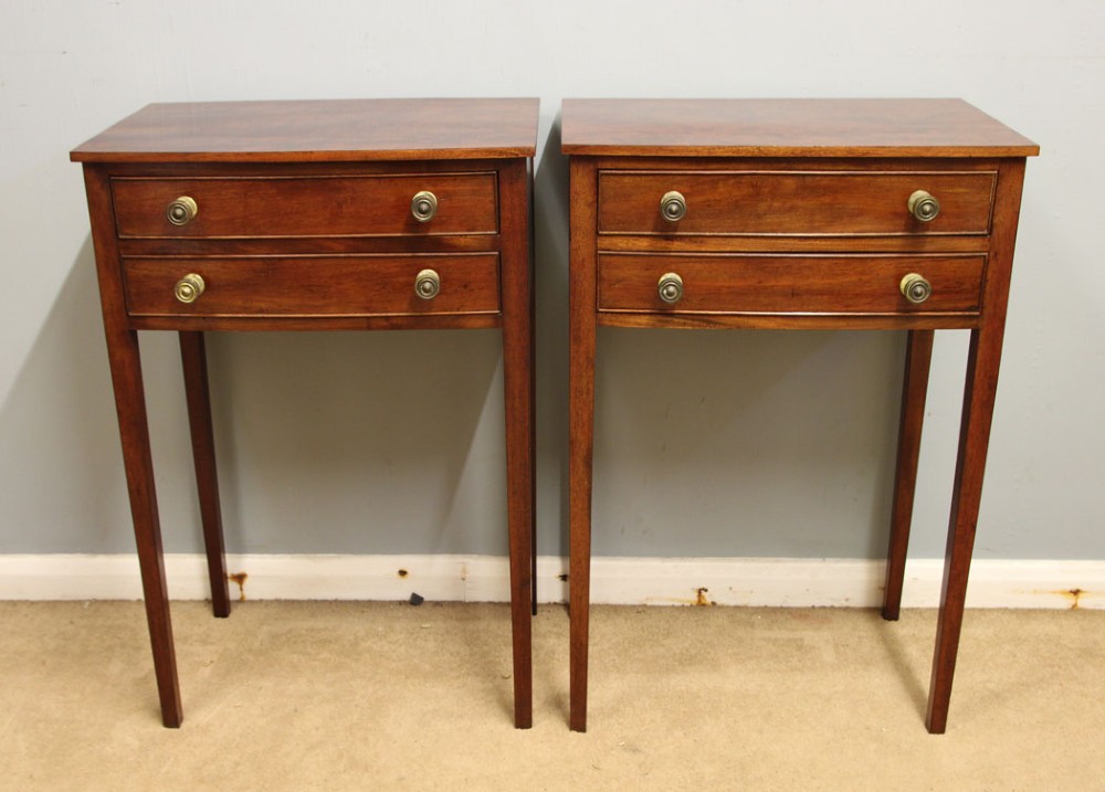 A pair of slim mahogany bedside tables, each featuring two drawers with brass knobs and tall square tapered legs. View II
