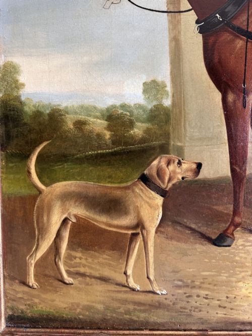 fig 2. A 19th-century oil painting depicting two brown carriage horses in harness standing beside a hound, set within a beaded gilt frame.