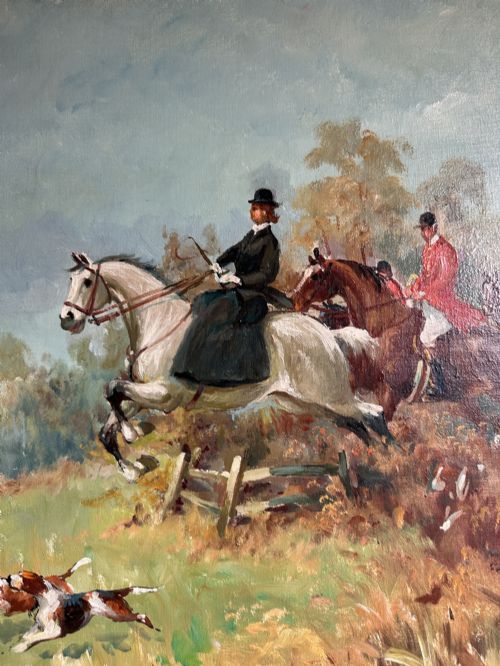 fig 1. An oil painting depicting a fox hunting scene with horse riders and foxhounds across a green countryside landscape, presented in a gold gilded wooden frame.