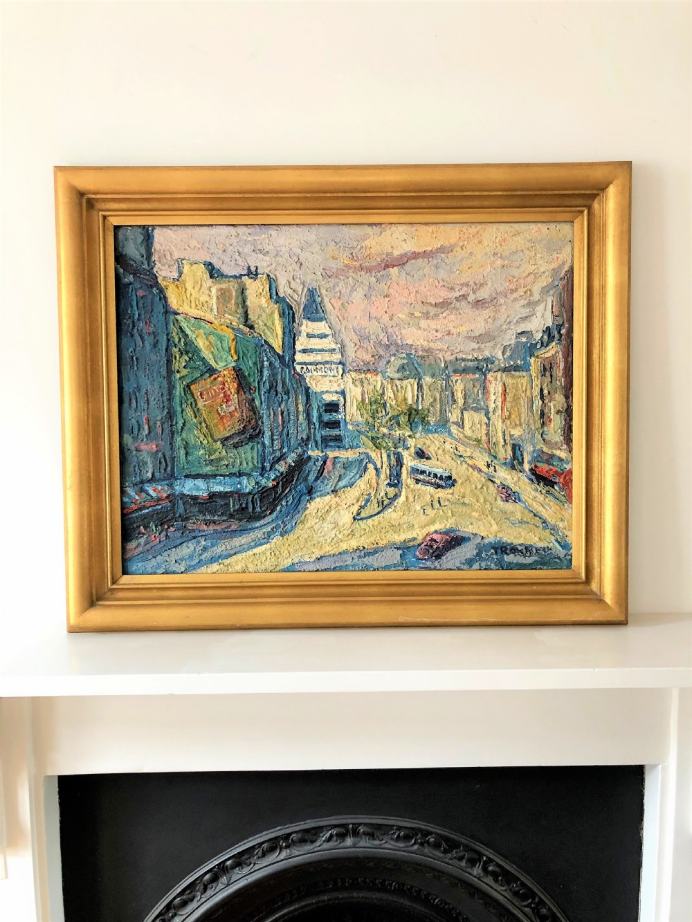 A framed mid-century oil painting depicting a Paris street scene rendered in heavy impasto strokes with yellow, blue, and pink tones inside a molded gold frame. View II