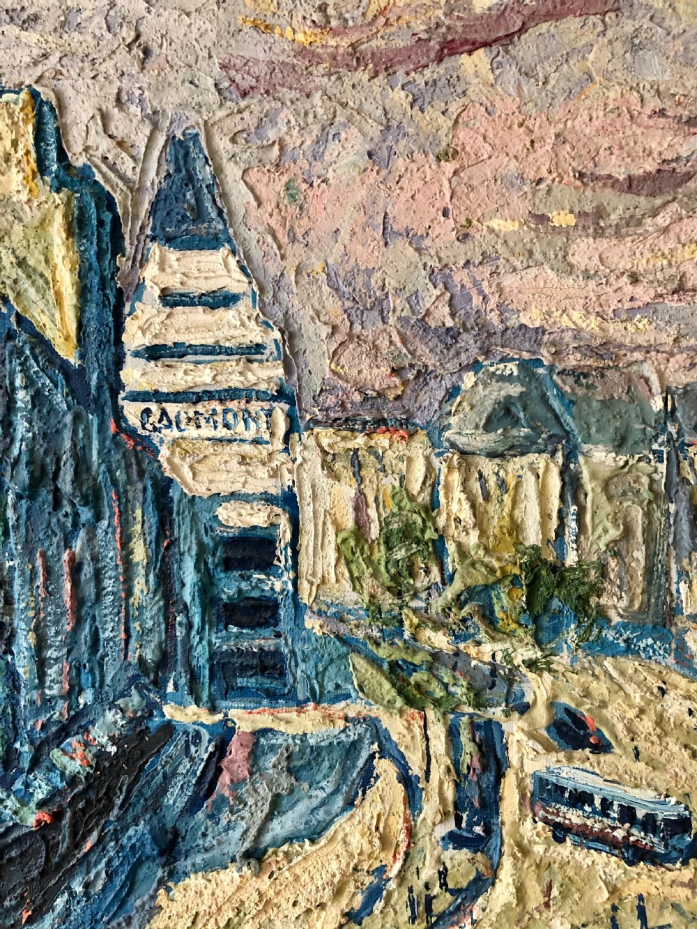 A framed mid-century oil painting depicting a Paris street scene rendered in heavy impasto strokes with yellow, blue, and pink tones inside a molded gold frame. View IV