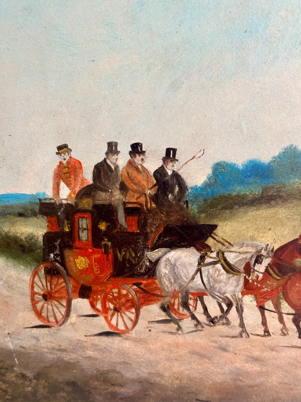 A pair of framed Edwardian oil paintings depicting horse-drawn coaches and fox hunting scenes within carved giltwood frames. View VIII