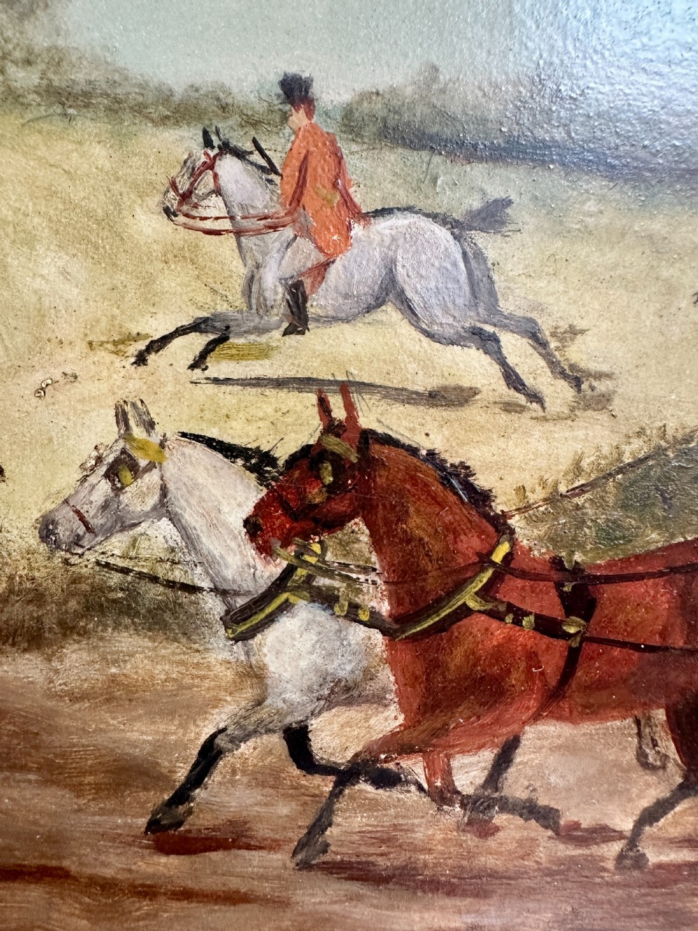 A pair of framed Edwardian oil paintings depicting horse-drawn coaches and fox hunting scenes within carved giltwood frames. View XVII