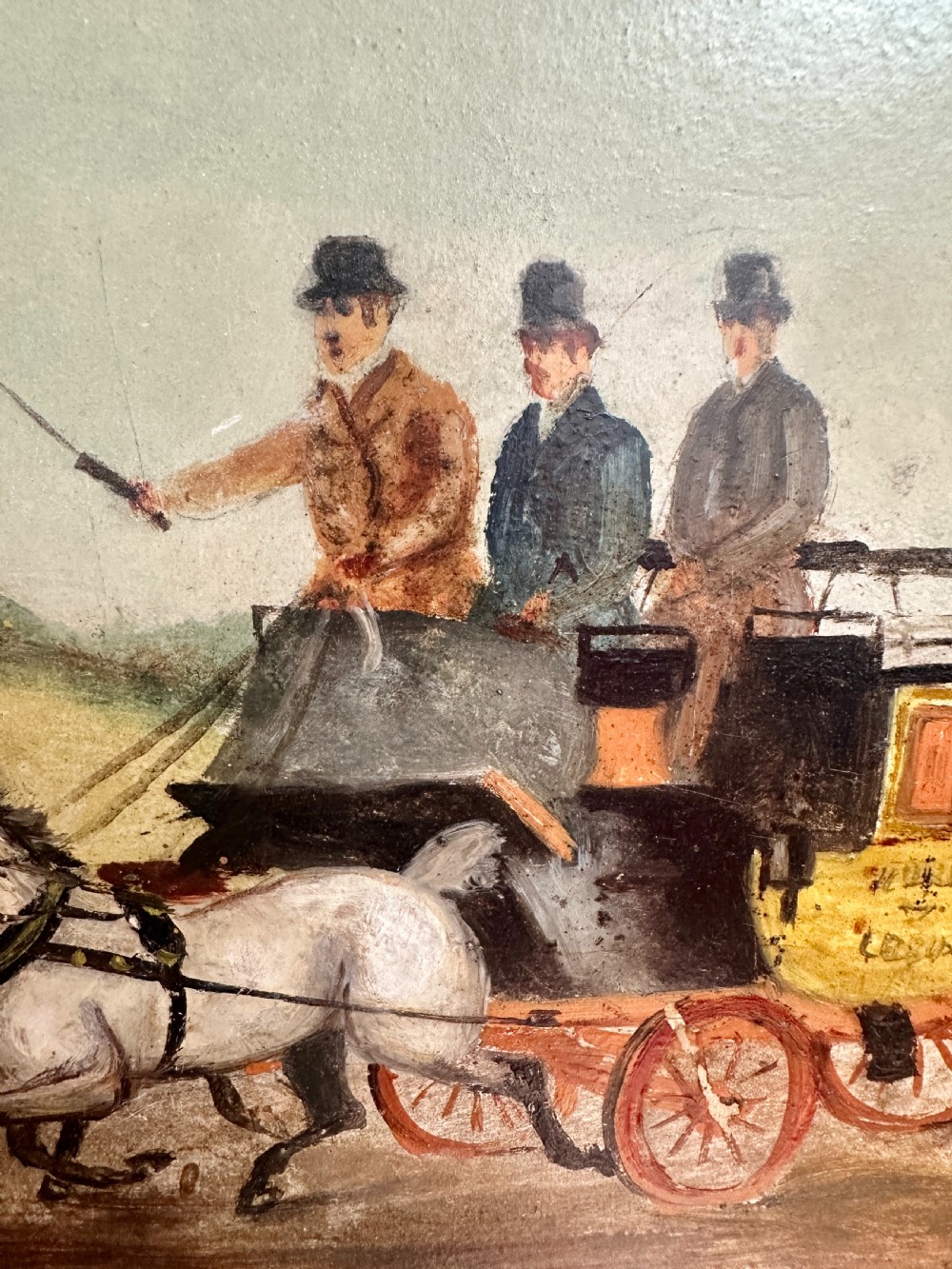 A pair of framed Edwardian oil paintings depicting horse-drawn coaches and fox hunting scenes within carved giltwood frames. View XIX
