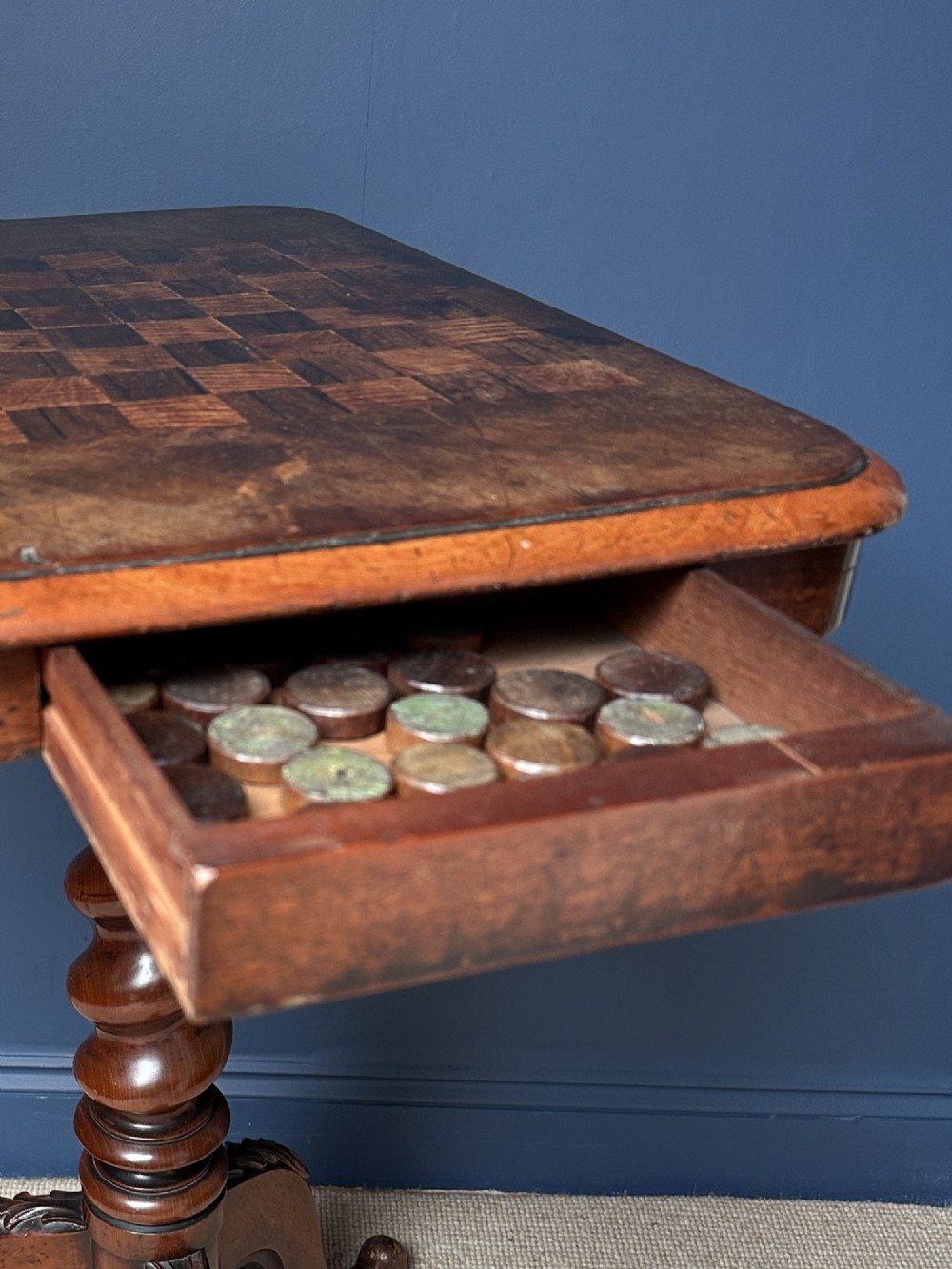 A Victorian walnut games table featuring a square top with an inlaid wooden chessboard surface, supported by a central barley twist column and carved tripod legs. View IV