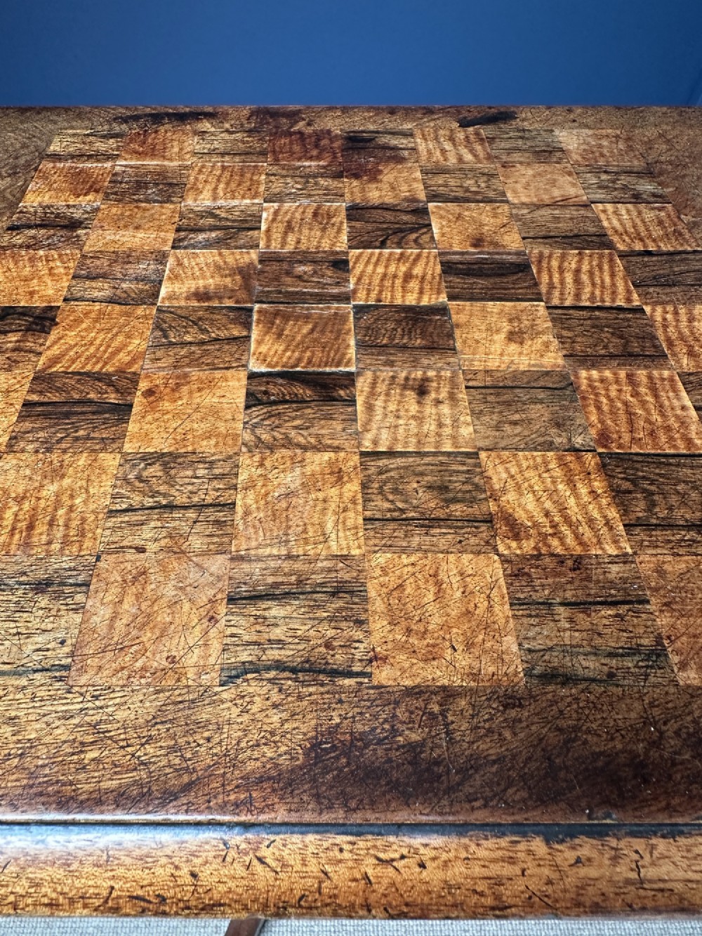 A Victorian walnut games table featuring a square top with an inlaid wooden chessboard surface, supported by a central barley twist column and carved tripod legs. View VI
