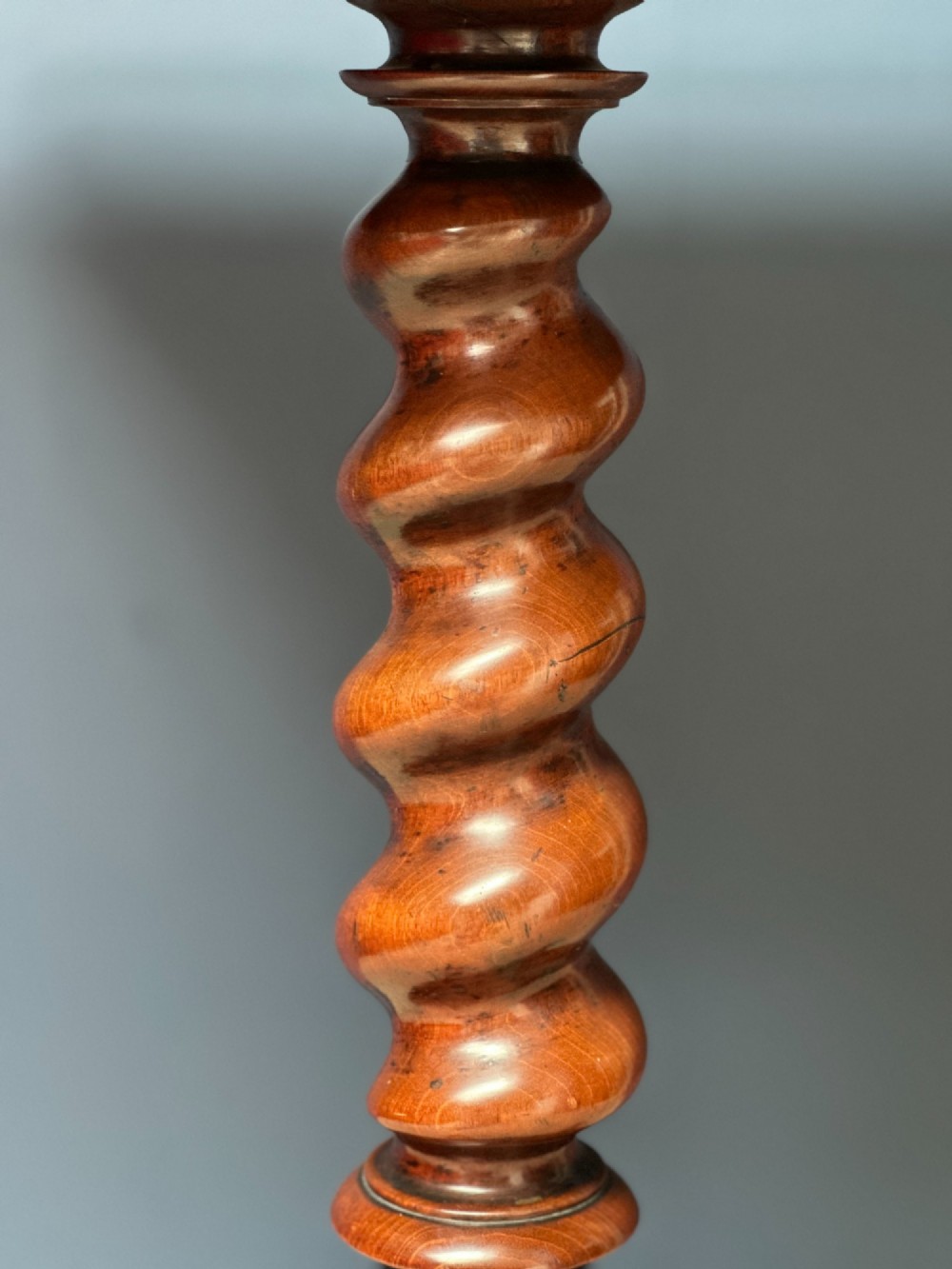 A Victorian walnut games table featuring a square top with an inlaid wooden chessboard surface, supported by a central barley twist column and carved tripod legs. View VII