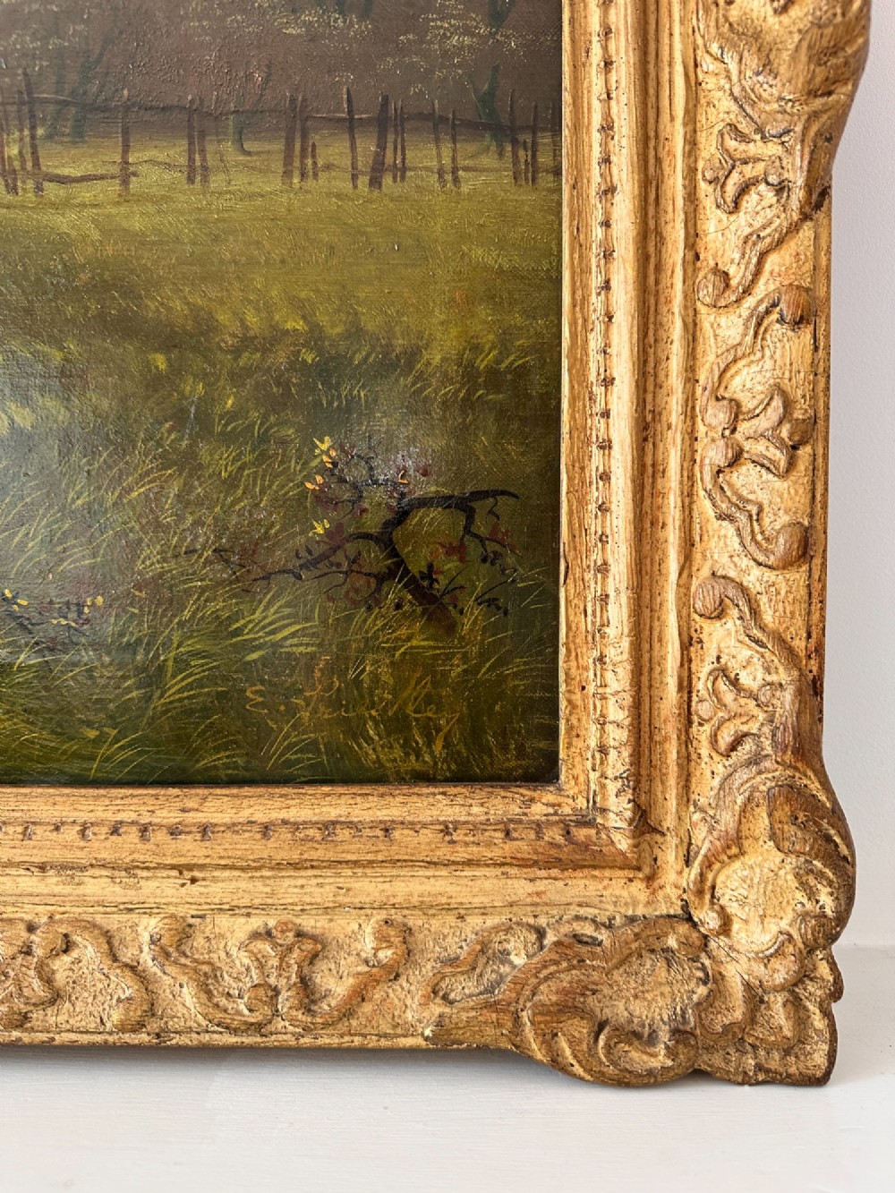 A 19th-century oil painting on canvas depicting three galloping horses in a landscape with a steam train in the background, framed in an ornate gilded wood frame. View V