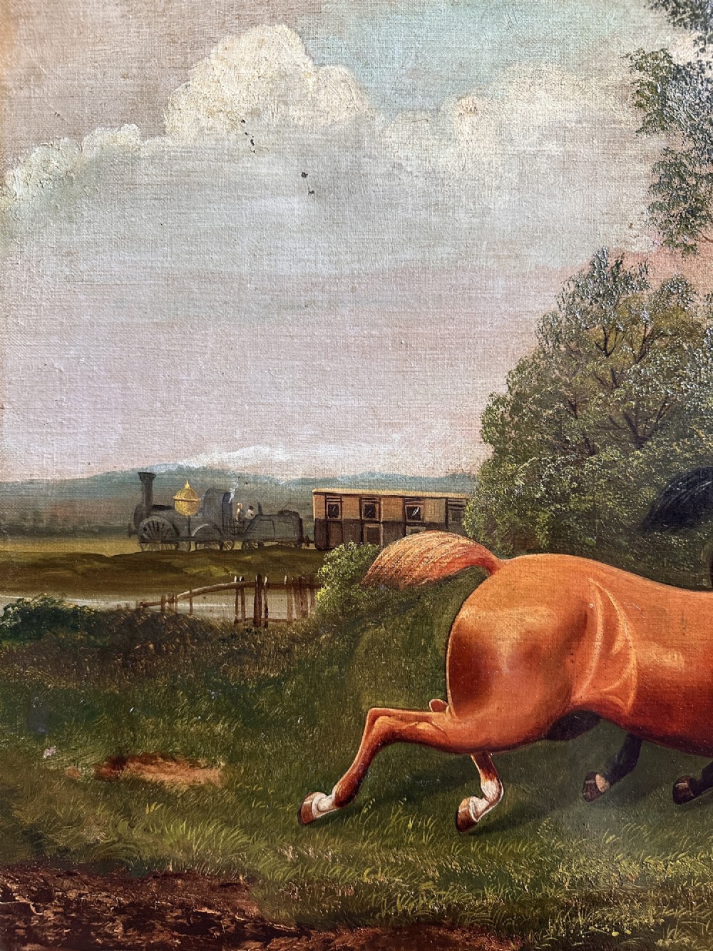 A 19th-century oil painting on canvas depicting three galloping horses in a landscape with a steam train in the background, framed in an ornate gilded wood frame. View VI
