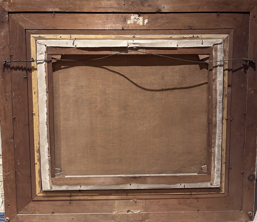 An 1896 oil painting depicting a dark brown horse standing inside a stable, housed within a gilded frame with a brass nameplate. View X