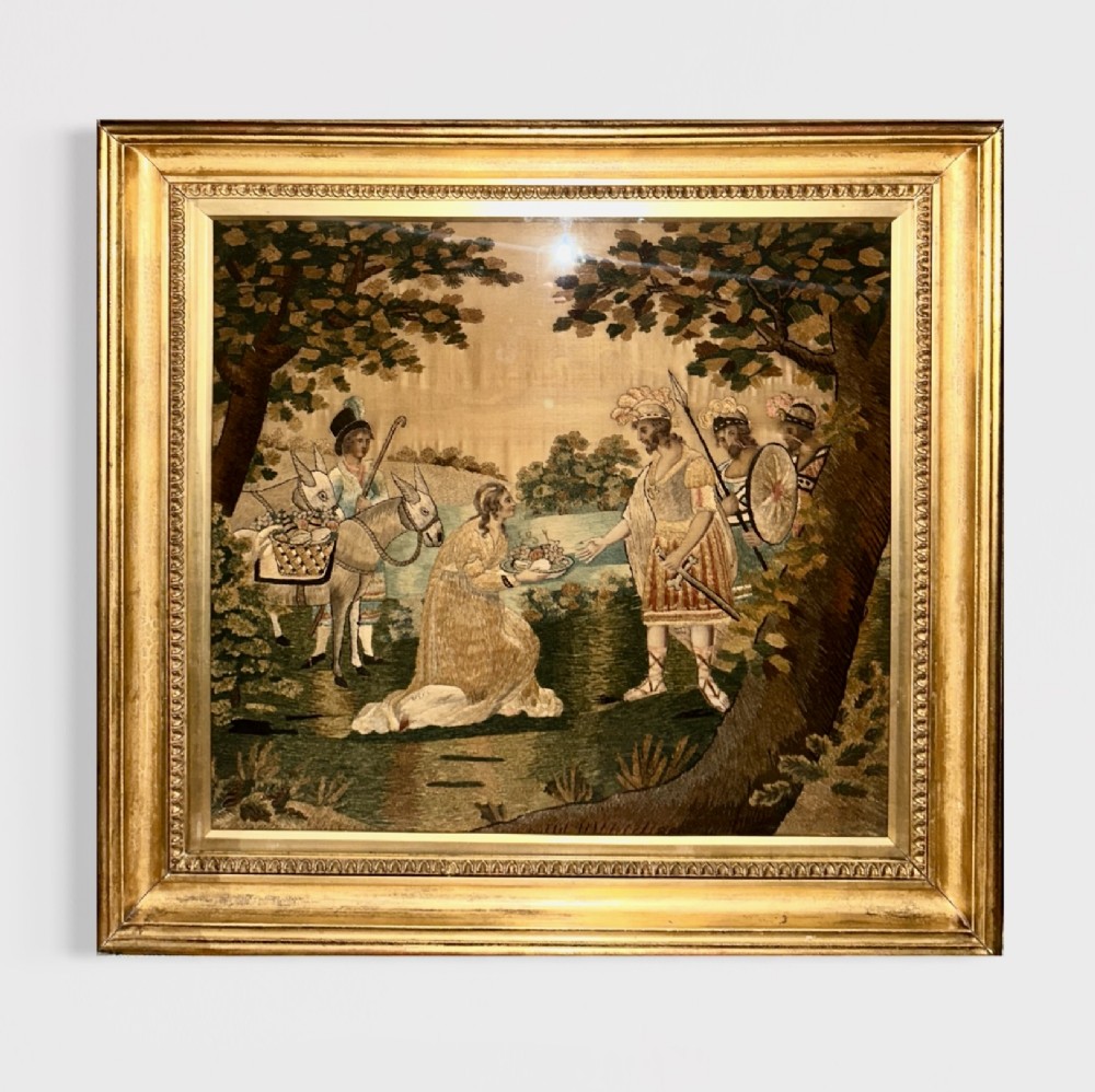 A framed Regency silk and chenille embroidery picture depicting the biblical narrative of Abigail before King David within a moulded gilt frame.