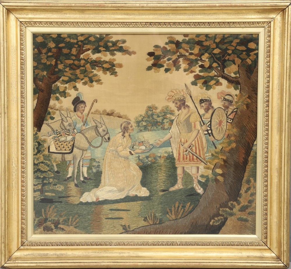 A framed Regency silk and chenille embroidery picture depicting the biblical narrative of Abigail before King David within a moulded gilt frame.