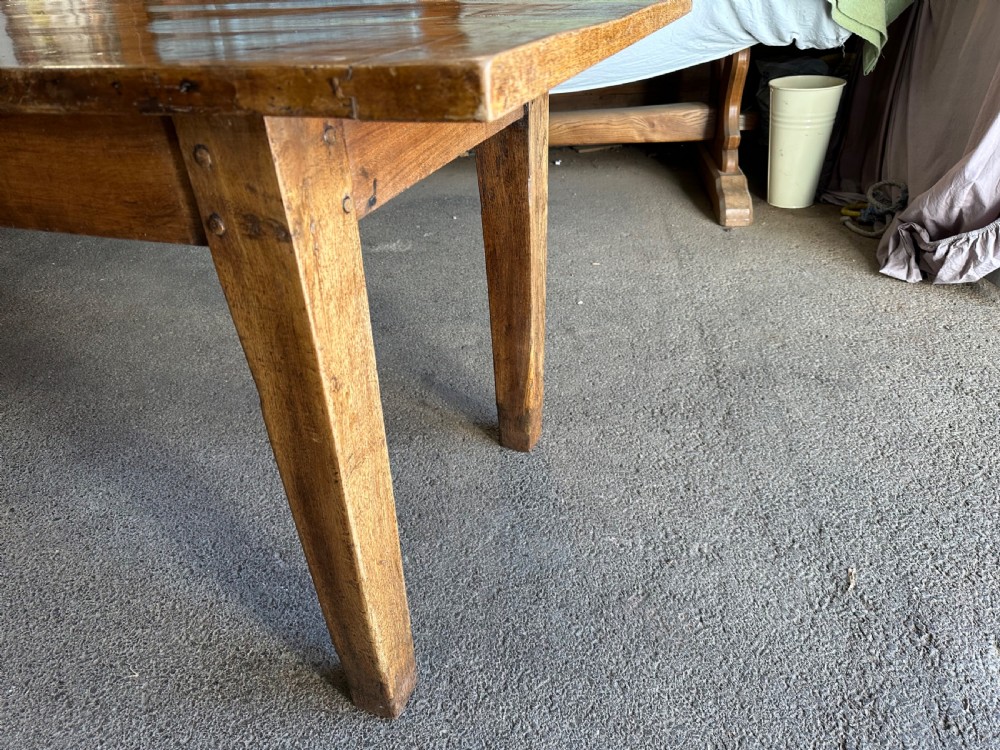 A nineteenth-century rectangular beech farmhouse dining table featuring a patinated wood top, a single side drawer with a small pull handle, and tapered wooden legs. View IV