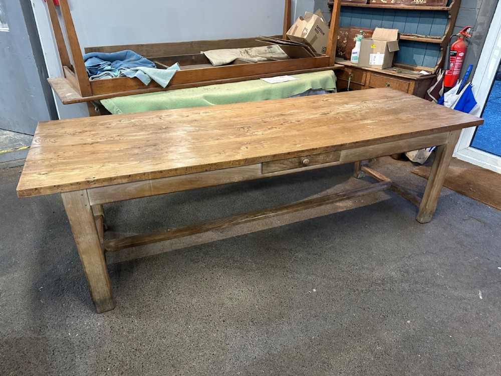 A nineteenth-century rectangular elm farmhouse table featuring a side frieze drawer, square legs, and a low stretcher rail. View IV