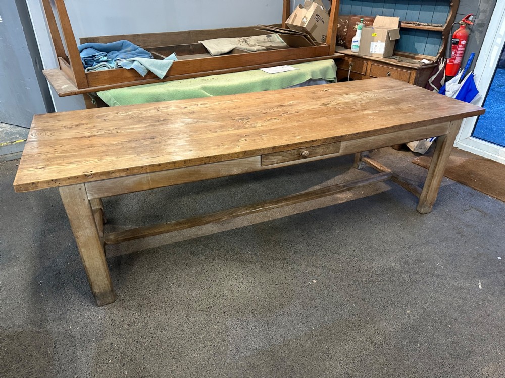 A nineteenth-century rectangular elm farmhouse table featuring a side frieze drawer, square legs, and a low stretcher rail. View V
