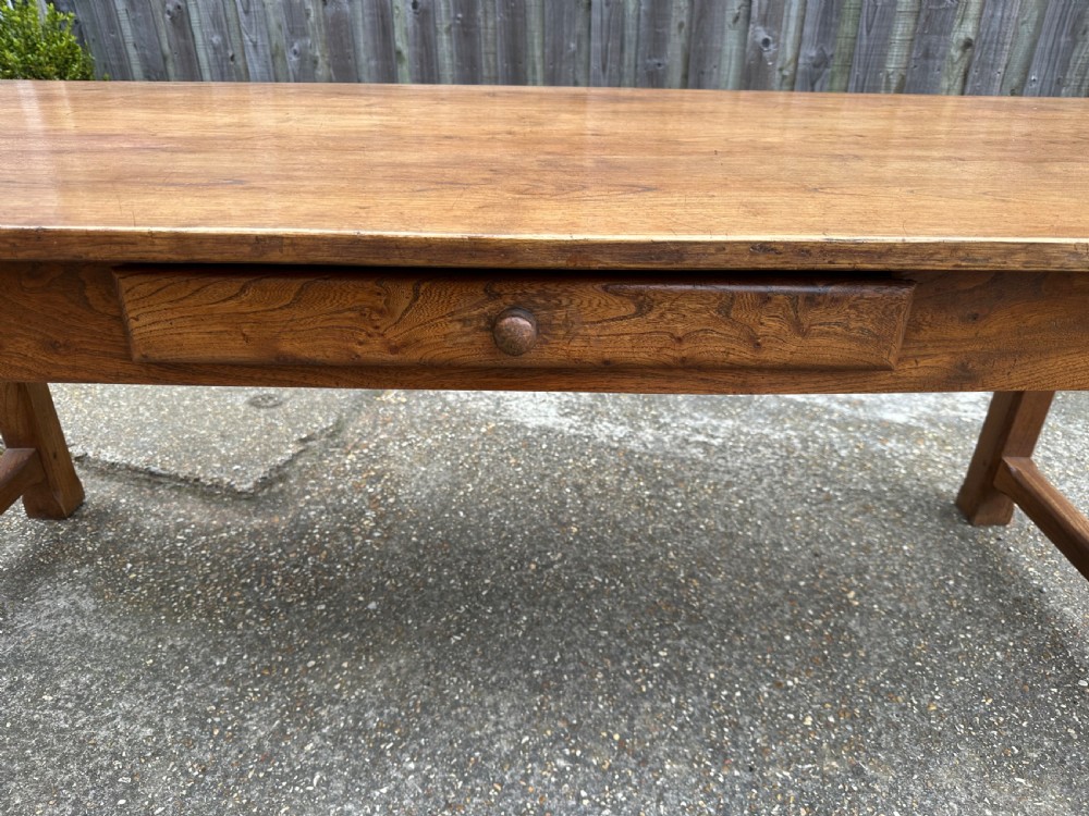 A 19th-century rectangular ash wood farmhouse dining table featuring a frieze drawer and end stretchers. View IV