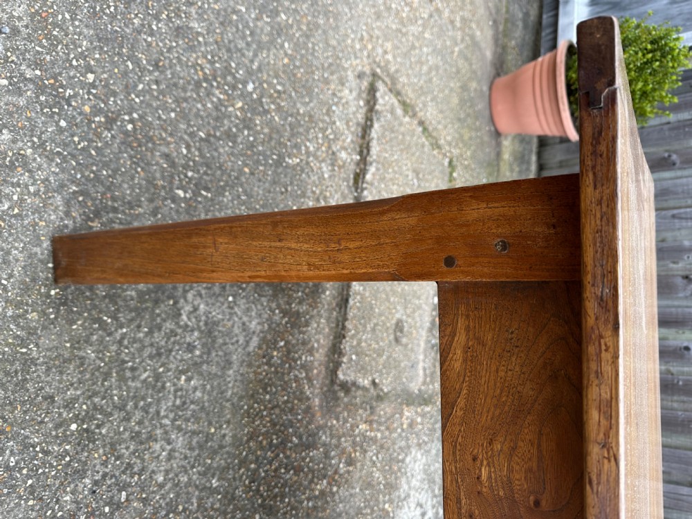 A 19th-century rectangular ash wood farmhouse dining table featuring a frieze drawer and end stretchers. View V
