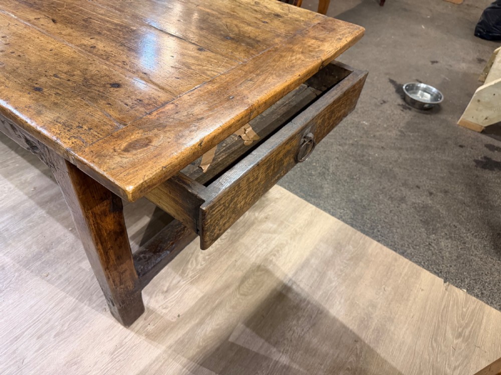 A long late 18th-century oak and beech farmhouse dining table featuring a plank top and squared legs joined by stretchers. View III