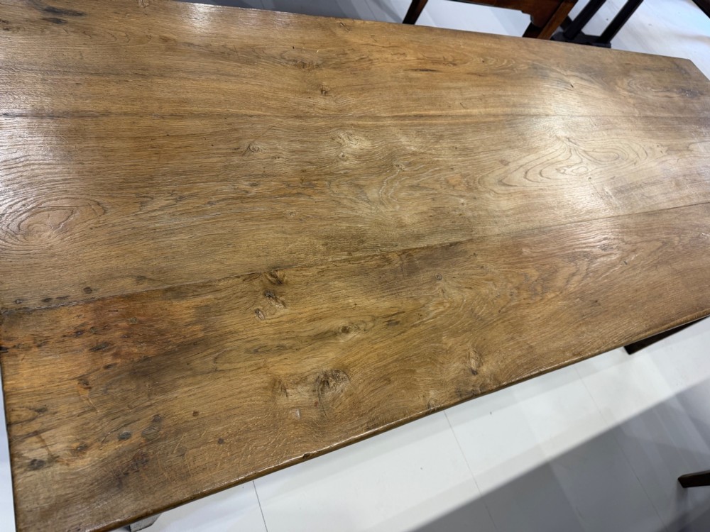 A rectangular 19th-century oak farmhouse dining table featuring a solid timber top with visible grain pattern supported by four straight tapered square legs. View II