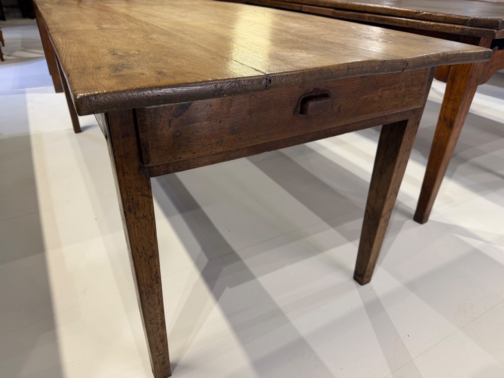 A rectangular 19th-century oak farmhouse dining table featuring a solid timber top with visible grain pattern supported by four straight tapered square legs. View III