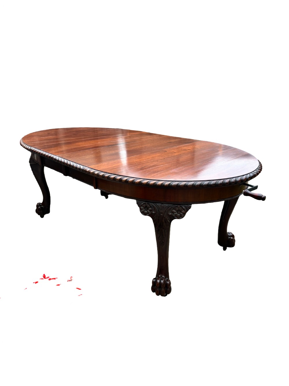 An oval mahogany Chippendale style extending dining table with carved cabriole legs, ball and claw feet, and a rope-twist carved apron rim. View III