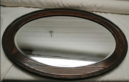 a large edwardian oval oak mirror - CATEGORY: ANTIQUE MIRRORS - DATED 1910