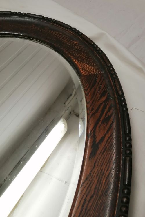 A LARGE EDWARDIAN OVAL OAK MIRROR - ADDITIONAL PHOTO 1