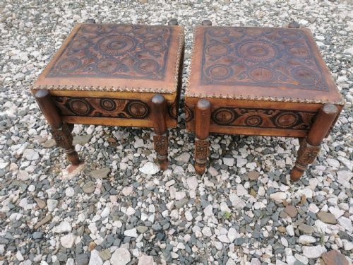a large pair of antique eastern embossed and decorated leather and walnut framed stools - CATEGORY: ANTIQUE STOOLS - DATED 1920