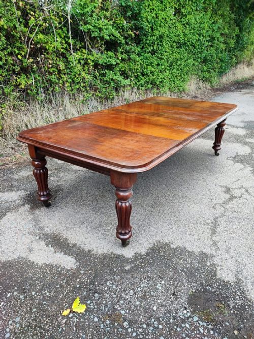 A FINE WILLIAM 1V MAHOGANY EXTENDING DINING TABLE WITH 2 LEAVES AND LEAF HOLDER - ADDITIONAL PHOTO 4