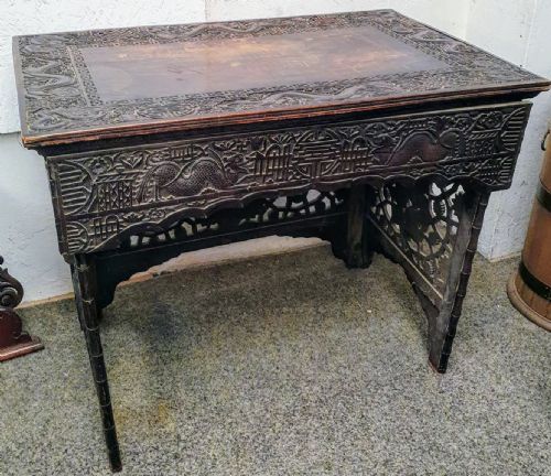 AN ANTIQUE ORIENTAL CARVED SCRIBES TABLE - ADDITIONAL PHOTO 1