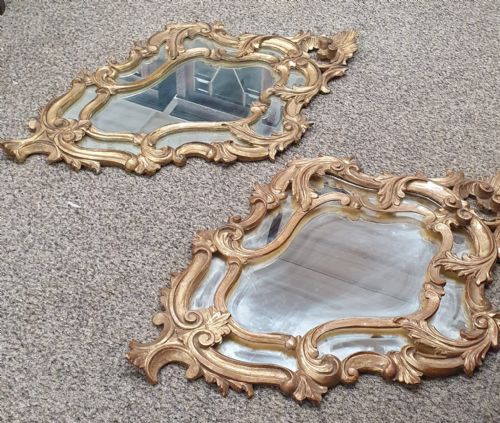 AN ANTIQUE PAIR OF ITALIAN CARVED GILTWOOD MIRRORS - ADDITIONAL PHOTO 1
