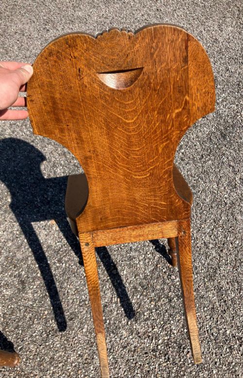 A PAIR OF REGENCY HALL CHAIRS IN OAK WITH HERALDIC PAINTED CRESTS - ADDITIONAL PHOTO 1