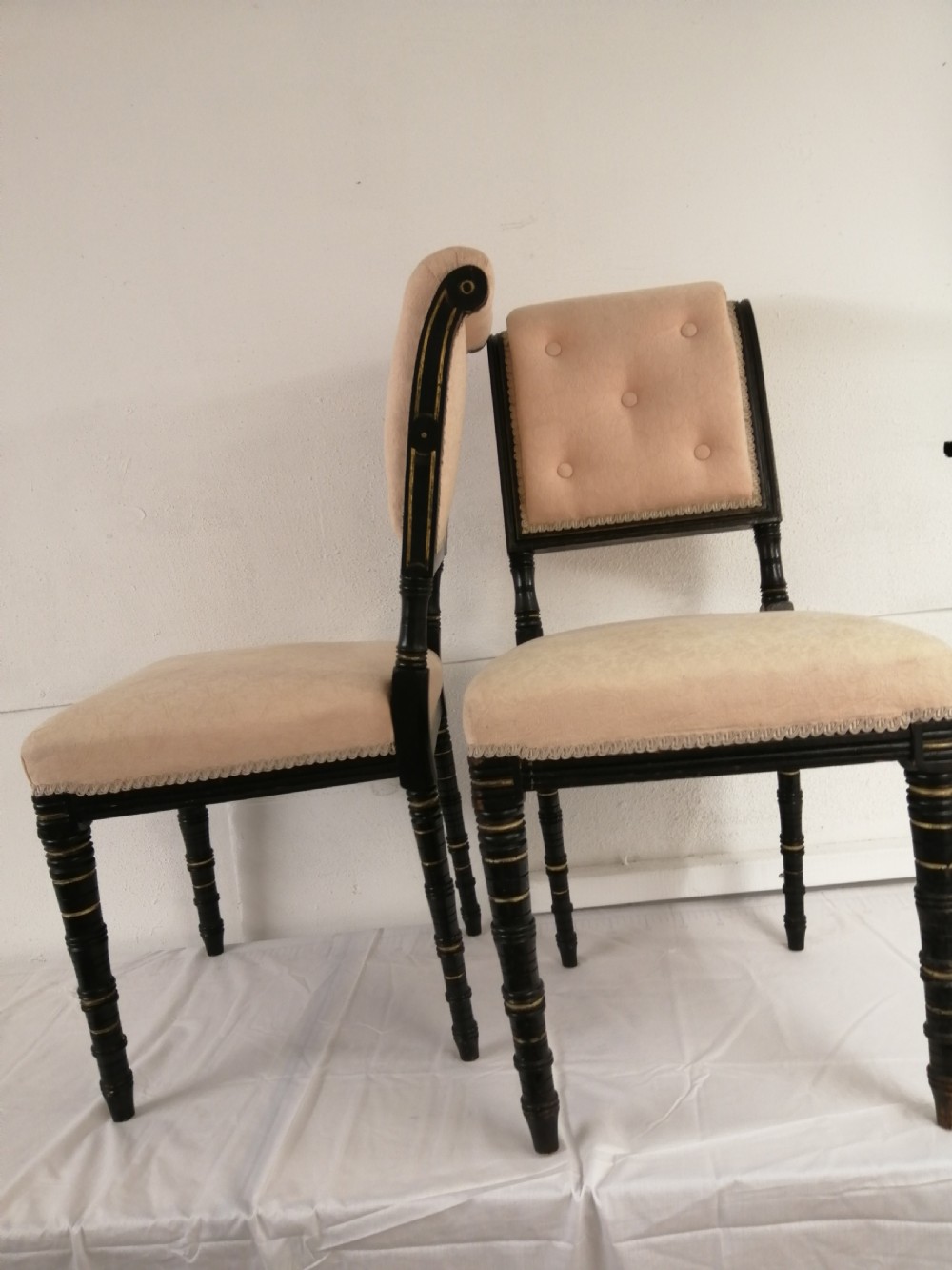 Pair of asthetic movement gilt and ebonised side chairs.