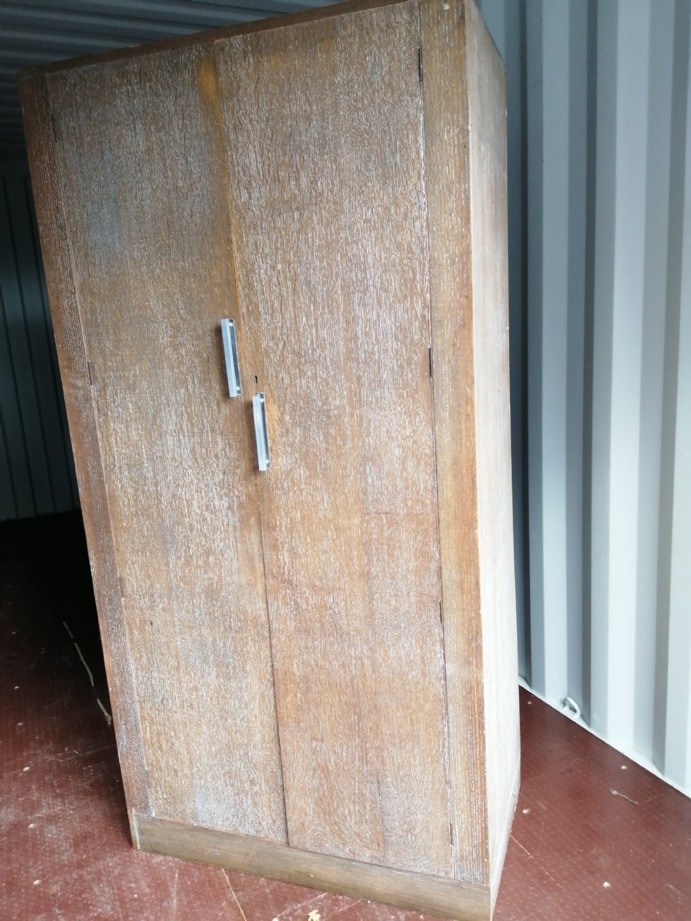 Art Deco limed oak wardrobe. in the style of heals