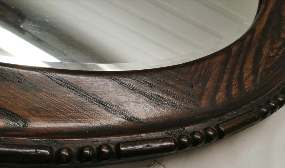 A large Edwardian oval oak mirror. View V