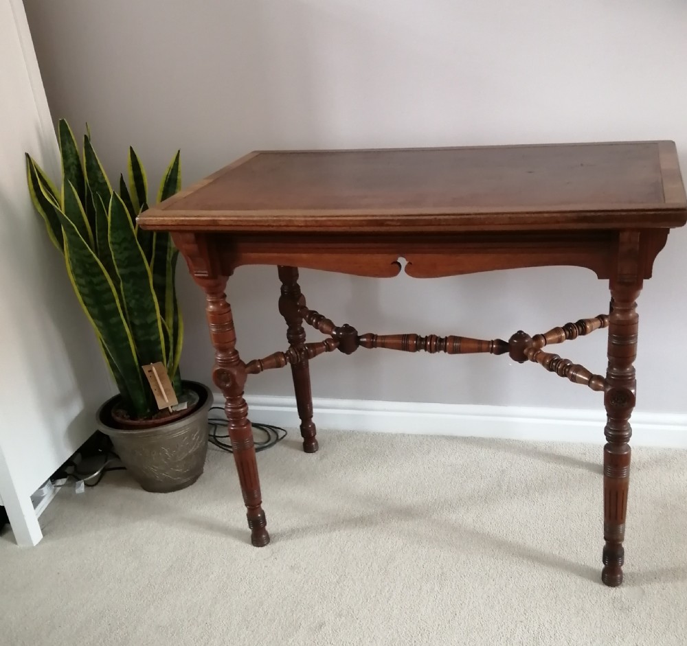 Victorian walnut arts and crafts writing table, by Gillow and Co.