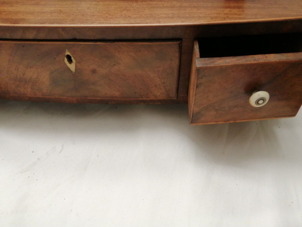 Georgian mahoganyoval dressing table mirror. View II