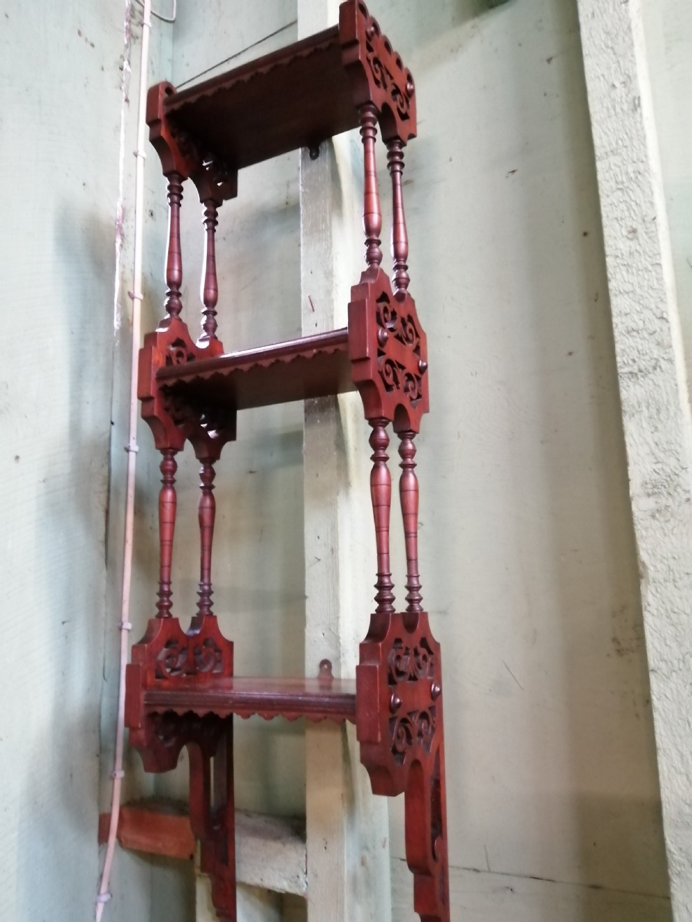Victorian walnut narrow hanging shelf.