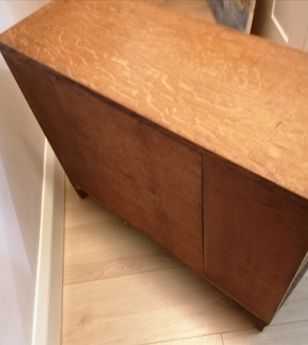 A small English solid oak open bookcase. View II