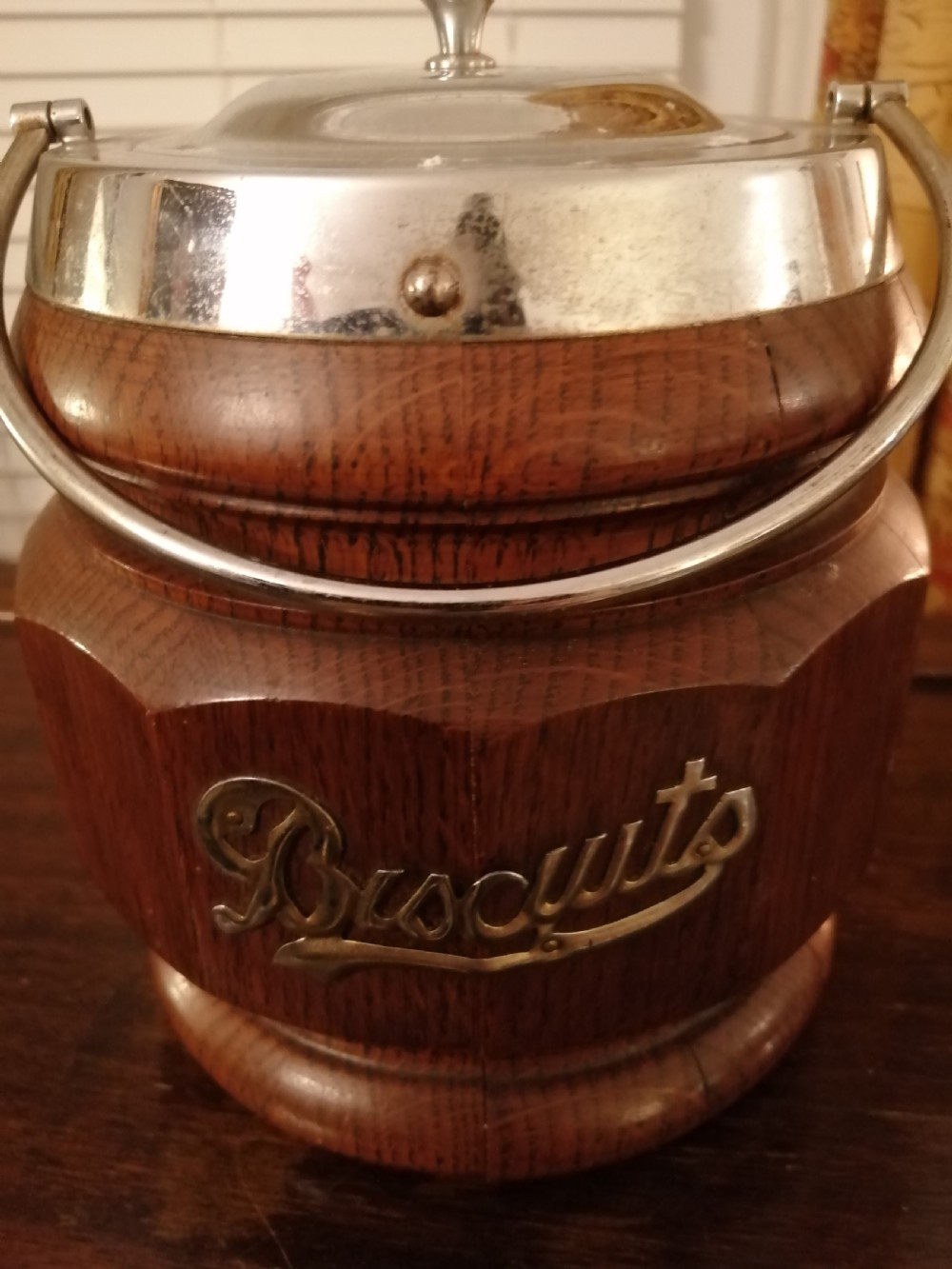 An antique oak biscuit barrel. View V