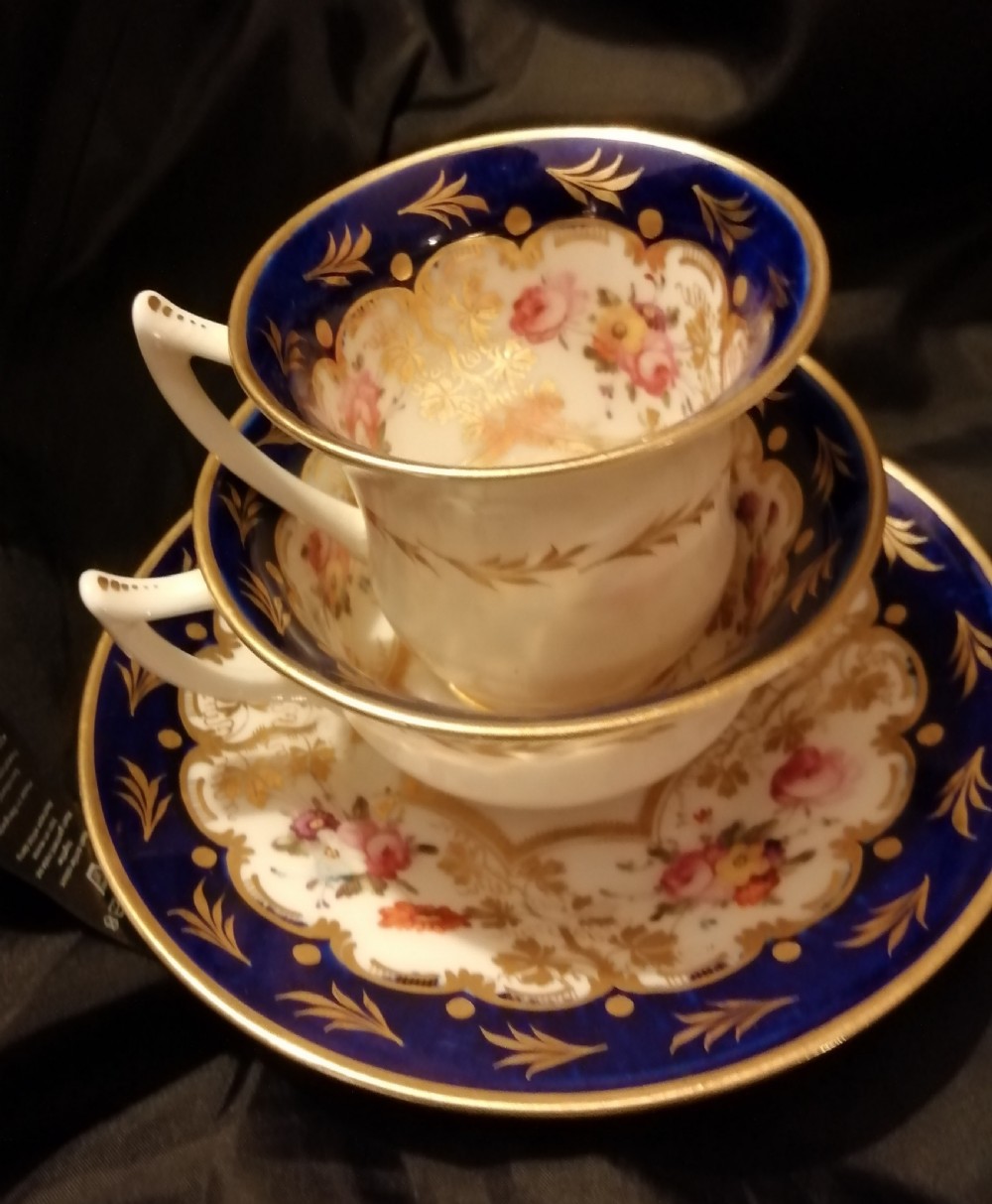 Antique cabinet set 2 cups 1 saucer. 