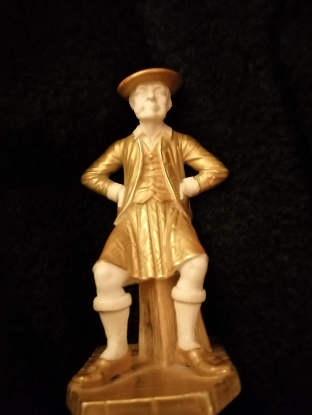      two royal worcester figures depicting a Scots man and yanky from countrys of the world series View XIII