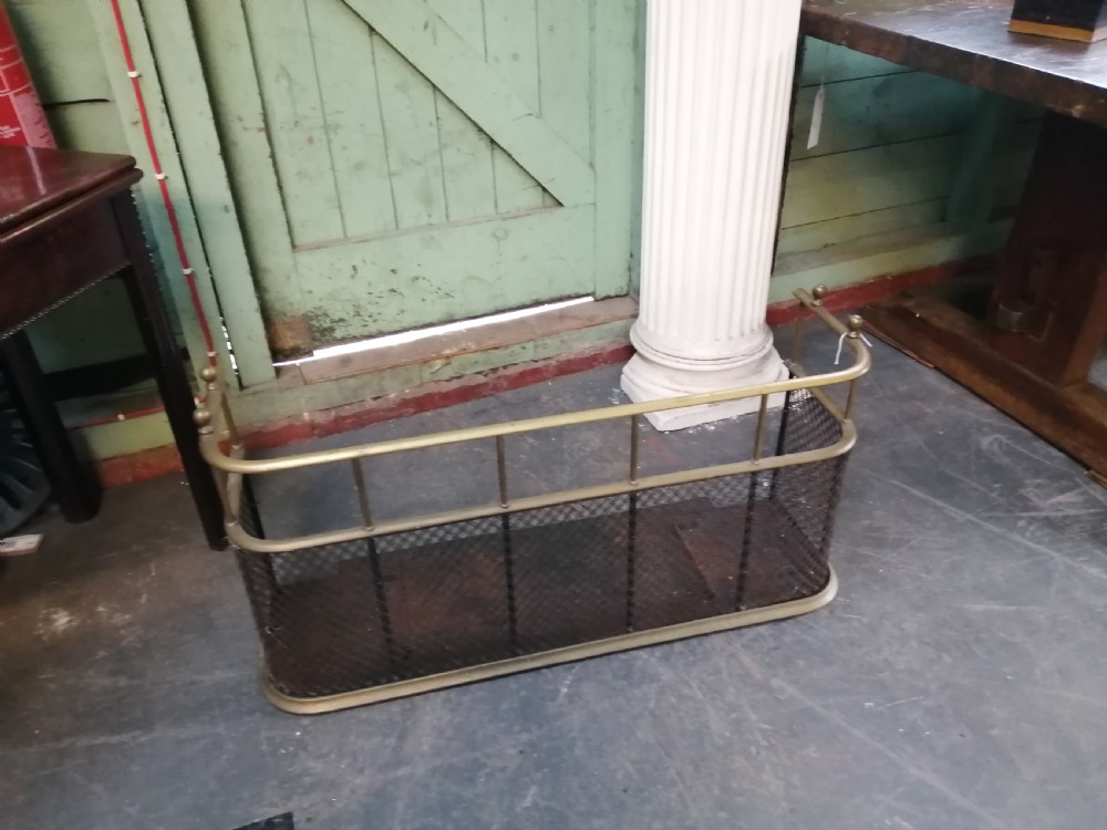 An attractive brass and mesh spark fender.